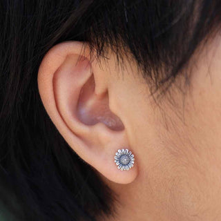 Sterling Silver Small Daisy Earrings on Ear