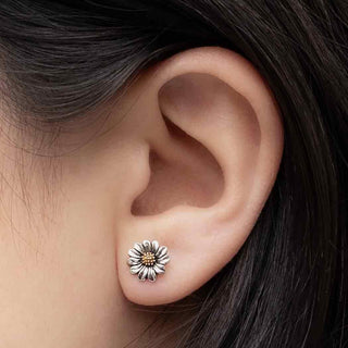 Sterling Silver and Bronze Daisy Earrings on ear