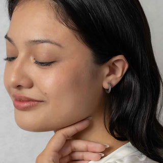 Sterling Silver Huggie Hoop Earrings on Woman