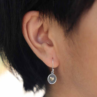 Silver Shadowbox with Small Bronze Heart Earrings on Ear