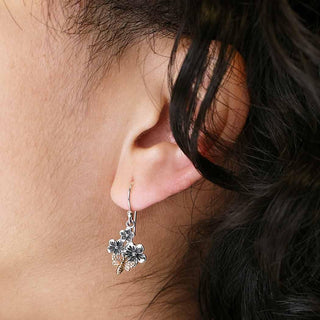 On ear photo of Sterling Silver Flower Dangle Earrings with Bronze Bee