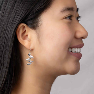 Sterling Silver Bat Cluster Dangle Earrings on model