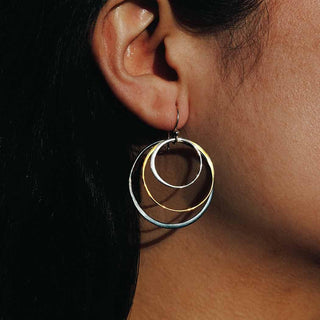 Large Tricolor Nested Circle Earrings on Ear