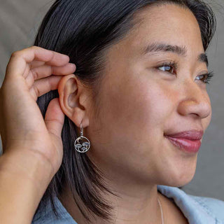 Silver Mushroom and Bronze Moon Earrings on Woman