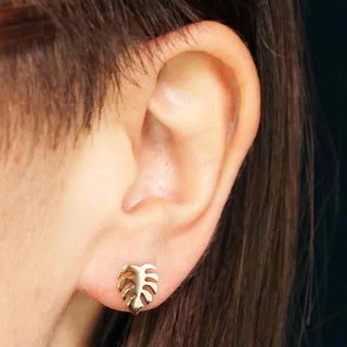 Bronze Monstera Leaf Earrings on Ear