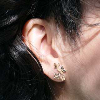 Bronze Butterfly Cluster Earrings on Ear