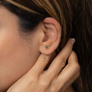 Bronze Stabbed Heart Earrings on Ear