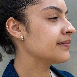 Bronze Chunky Teardrop Huggie Earring on Woman