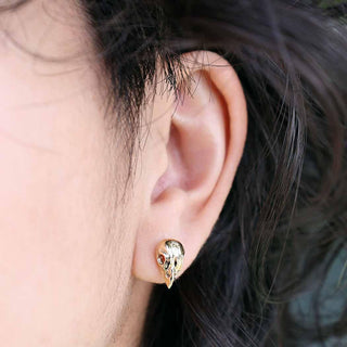 Bronze Small Bird Skull Earrings on Ear