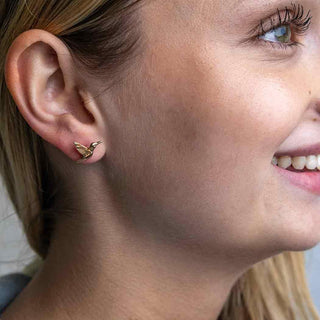 Bronze Flying Hummingbird Earrings on Woman