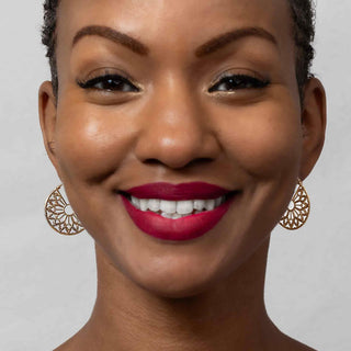 Bronze Cathedral Rose Window Hoop Earrings on model