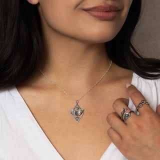 Women wearing silver rings and necklace