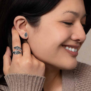 Women wearing dragon wing jewelry