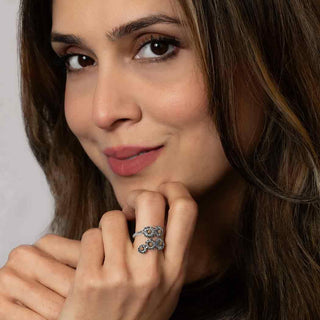 Women wearing mixed metal flower ring