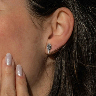 Silver Raven Skull Earrings on Ear