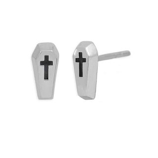 A pair of coffin-shaped stud earrings made of silver-toned metal with a black cross inlay on the front, shown on a plain white background.