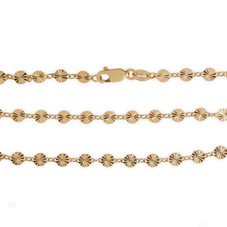 A gold chain necklace featuring repeating starburst or sunburst disc links, shown against a plain white background.