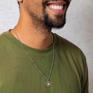 Bronze Sunburst Necklace on Man with Green Shirt