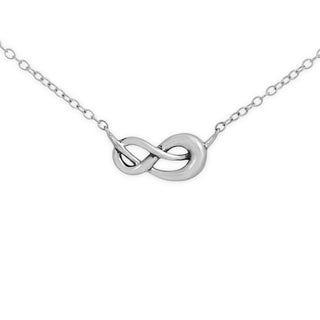 Silver infinity necklace on a white background