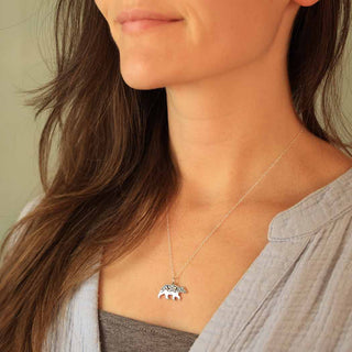 Sterling Silver Bear with Bronze Moon and Star Embellishment Necklace on Woman