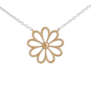 Gold flower-shaped pendant on a silver chain against a white background