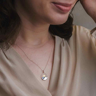 Sterling Silver Mountain Necklace with Bronze Sun on model