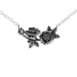 Silver wild rose festoon necklace on a white background