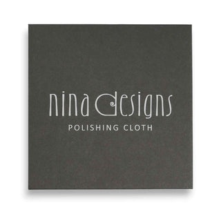 Nina Designs polishing cloth packaging on a white background