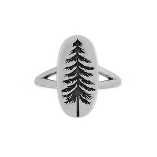 A silver ring featuring an oval face with a black engraved pine tree design, set against a plain white background.