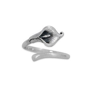 Silver ring with a calla lily design on a white background