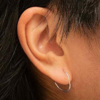 Sterling Silver Half Hammered 15mm Hoop Earrings on Ear