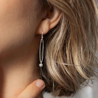 Long Oval Link Dangle Earrings w Pearl Drop on model ear