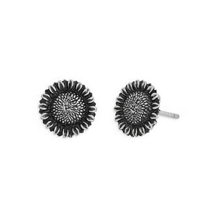A pair of textured black and silver flower stud earrings on a plain white background.