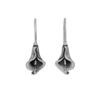 Pair of silver calla lily earrings on a white background