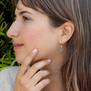 Sterling Silver Pinecone Dangle Earrings on model ear
