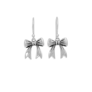 Sterling silver Bow dangle earrings on white background. 
