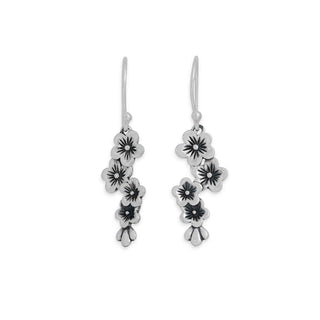 Silver floral earrings on a white background
