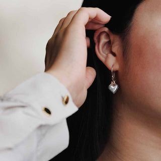 Silver Heart with Bronze Flame Earrings on Ear 