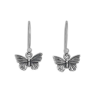 Butterfly-shaped silver earrings on a white background