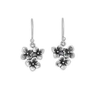 Silver floral earrings on a white background