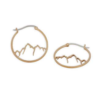 Bronze hoop earrings with mountain design on a white background