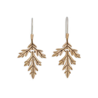 Pair of bronze mugwort leaf-shaped earrings on a white background