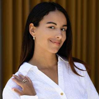 Bronze Curved Teardrop Post Earrings on model wearing white shirt and bronze ring