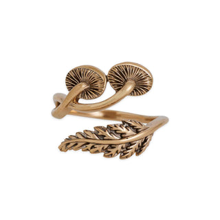 Bronze ring with mushroom and leaf designs on a white background