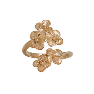 Gold floral ring on a white background