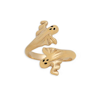 A gold-toned open ring designed to look like two ghostly figures facing each other, with small black dot eyes, shown on a plain white background.
