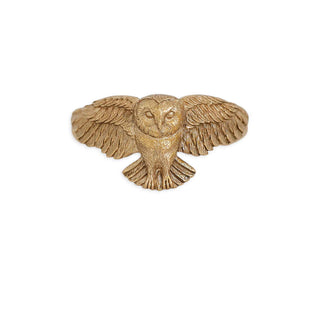 A small owl-shaped ring in a textured gold-tone metal, shown against a plain white background.