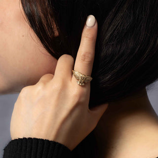 Bronze Owl Ring on  woman's hand holding her hair
