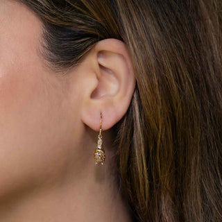 Bronze Bat Earrings on Ear