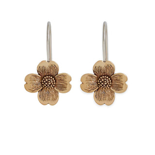 Pair of bronze dogwood flowershaped earrings on a white background